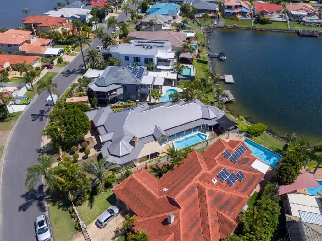 Large residential home by the water with a new metal roof