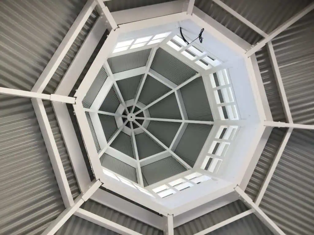 Looking up at the underside of a metal roof in a gazebo